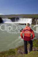 Woman Tourist At Godafoss Waterfall, Iceland