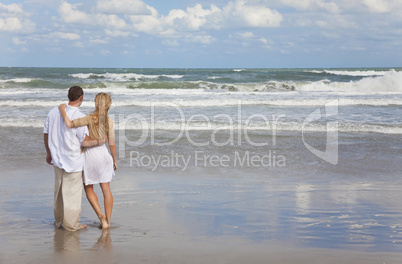 Romantic Man and Woman Couple Embracing On A Beach