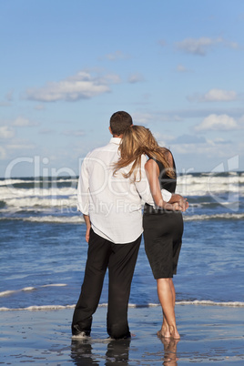 Romantic Man and Woman Couple Embracing On A Beach