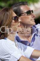 Attractive Thirties Couple In Sunshine Wearing Sunglasses