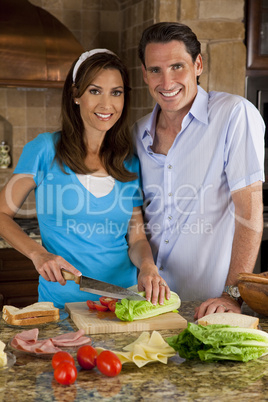 Attractive Man & Woman Couple In Kitchen Making Healthy Sandwich