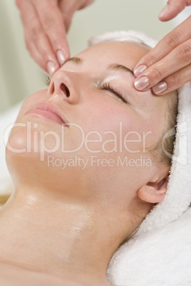 Young Woman Getting Relaxing Head Massage or Facial At Spa