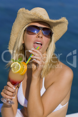 Beutiful Blond Girl In Bikini Drinking Cocktail By The Sea