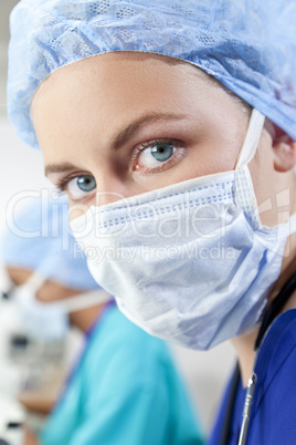 Female Scientist or Doctor wearing Surgical Mask in a Laboratory