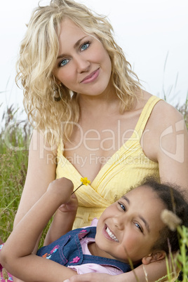 Beautiful Mother and Mixed Race African American Child In Field