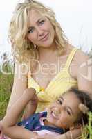 Beautiful Mother and Mixed Race African American Child In Field