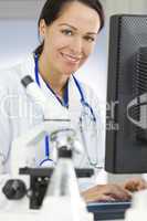 Female Scientist or Doctor Using Computer In Laboratory