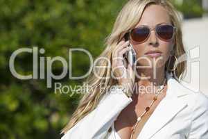 Beautiful Blond Woman In Sunglasses Talking On Cell Phone