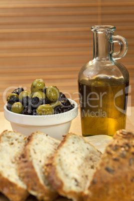 Olive Oil, Stuffed Green and Black Olives and Rustic Bread