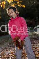 Beautiful Mixed Race African American Girl Playing With Fall Lea