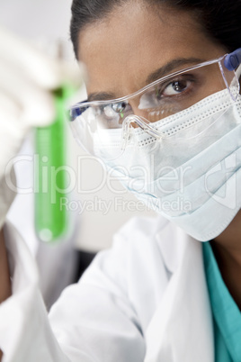 Asian Female Scientist in Laboratory with Green Test Tube