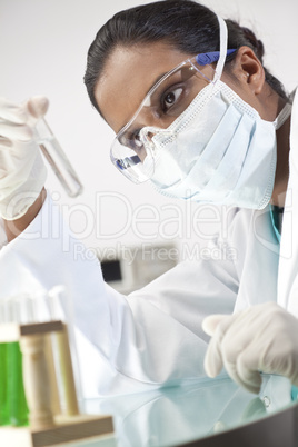Female Asian Laboratory Scientist With Test Tube of Clear Soluti