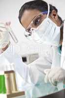 Female Asian Laboratory Scientist With Test Tube of Clear Soluti
