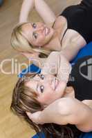 Two Beautiful Young Woman Aerobic Exercising At A Gym