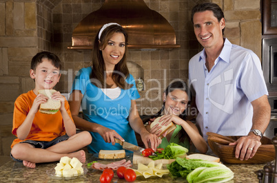 Attractive Family In Kitchen Making Healthy Sandwiches