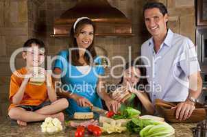 Attractive Family In Kitchen Making Healthy Sandwiches
