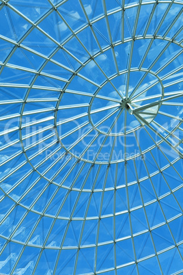 Blue Sky Through a Modern Architecture Round Spiral Window.