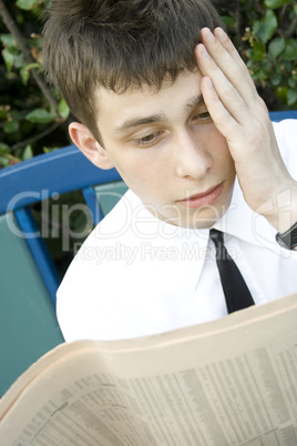 Young man Reading Newspaper