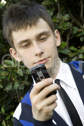 Young man looking at mobile phone