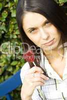 Girl with a lollipop in the shape of a heart