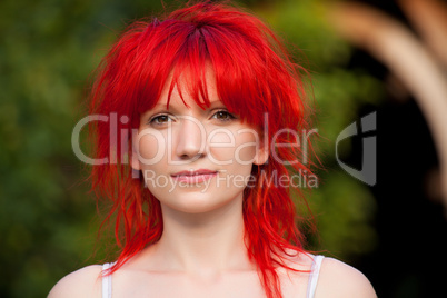 Portrait of redhead woman looking at camera