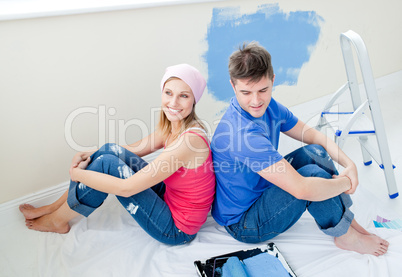 Lovng couple painting a room