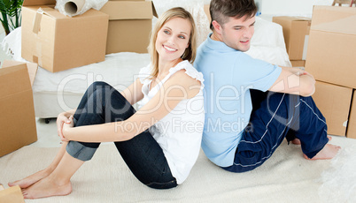 Young couple relaxing after moving