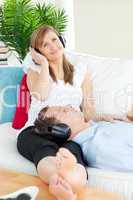 Happy couple listening music with headphones
