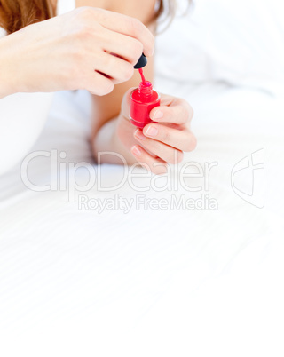 Close-up of a woman holding a nail varnish