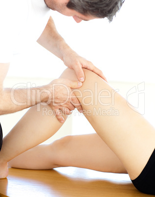Close-up of a physical therapist giving a leg massage