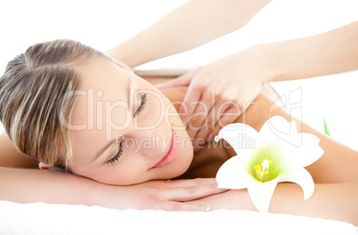 Relaxed woman receiving a back massage