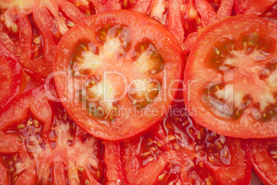 Background of peaces of red tomato