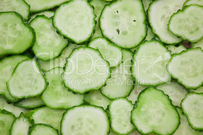 Background of peaces of green cucumber