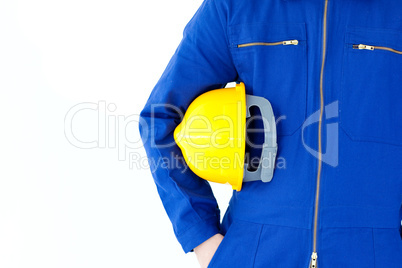 Close-up of a  man holding a yellow hardhat
