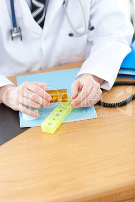 Close-up of a doctor giving pills to a paient