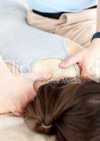 Close-up of a physical therapist giving a back massage