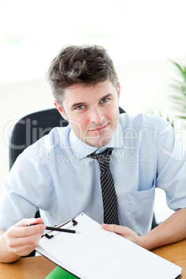 Smiling businessman showing a contract to a customer