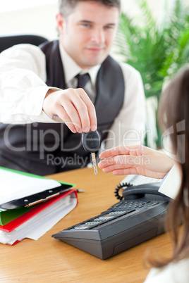 Smiling businessman holding car's key