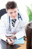 Confident male doctor giving pills to a paient