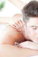 Relaxed man enjoying a back massage