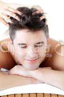Jolly man receiving a head massage