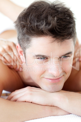 Handsome man enjoying a back massage