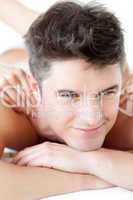 Handsome man enjoying a back massage