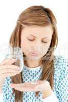 Sick woman taking pills
