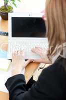 Close-up of a businesswoman working at a laptop
