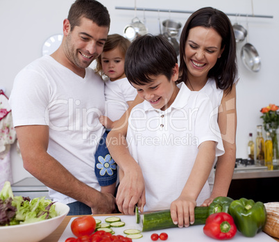 Happy young family cooking together