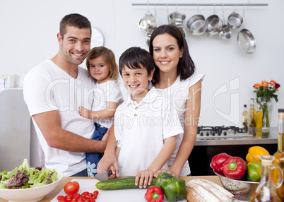 Smiling family cooking together