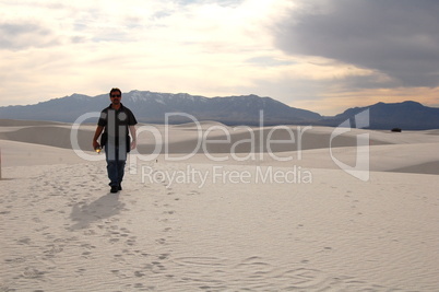 hiker on dunes - left