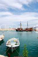 Venetian harbour of Rethymno with pirate ship, Crete, Greece