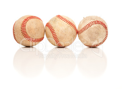 Three Baseballs Isolated on Reflective White